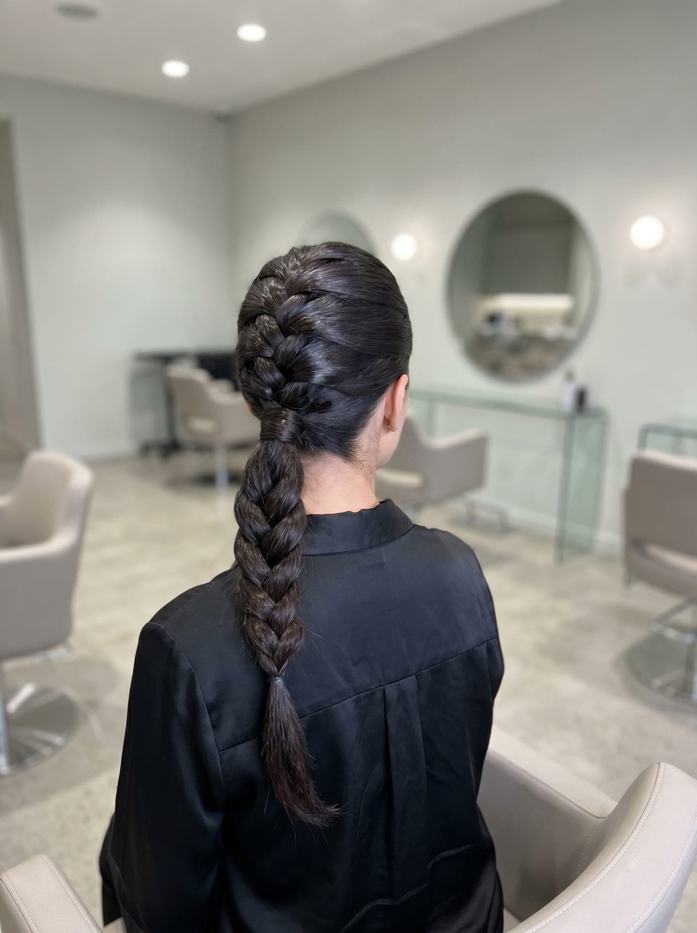 A sleek, intricate braided ponytail